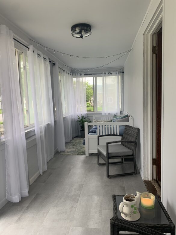 Cozy Sunroom featuring Waterproof Vinyl Plank Flooring